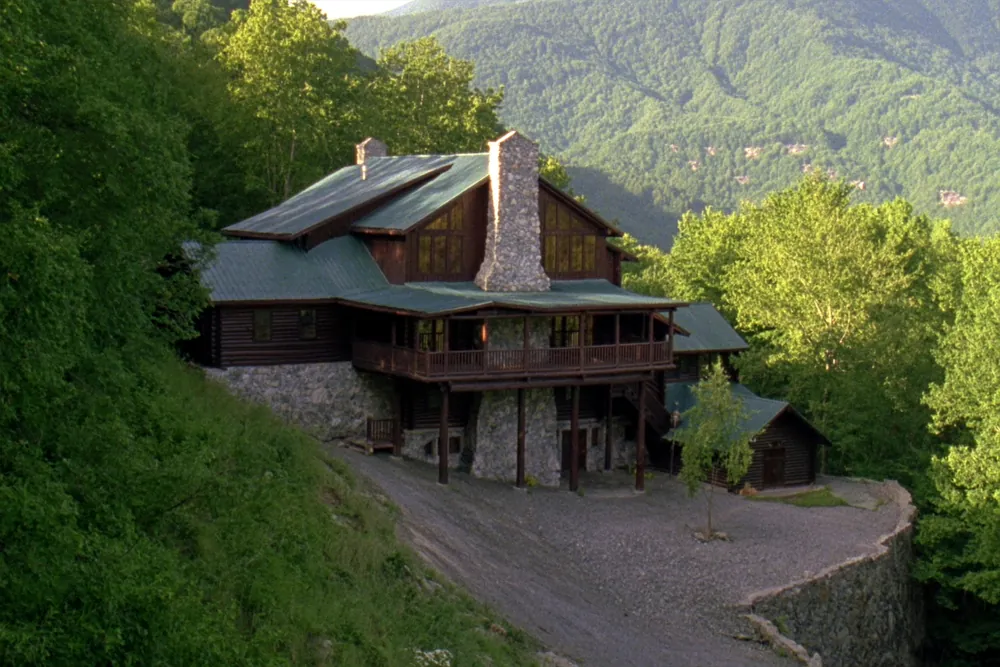 Multi-level rental cabin on a steep wooded hillside in Pigeon Forge, Tennessee
